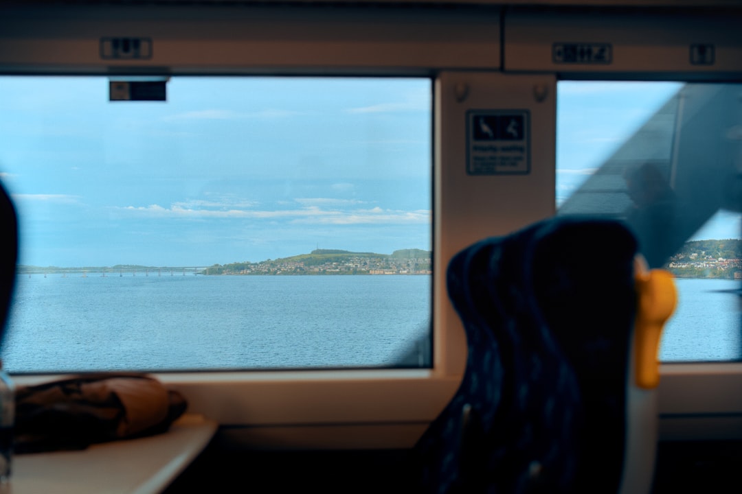 Slow Travel Itinerary cover with a notebook, map, and calm train window scene