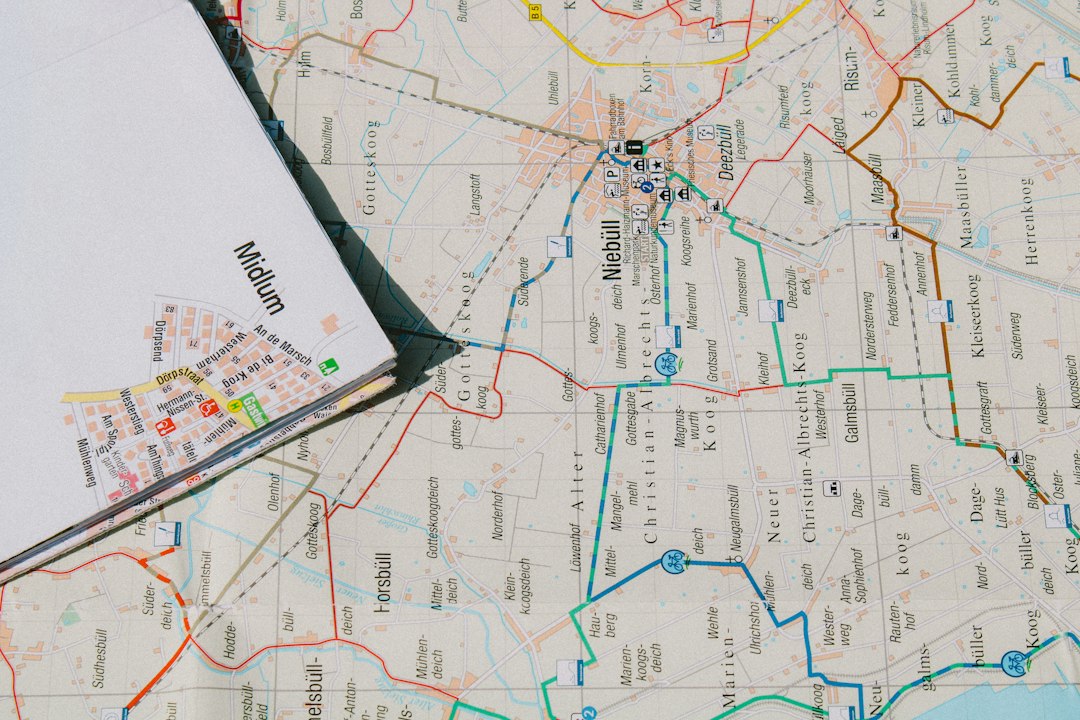 Minimal illustration for slow travel itinerary planning: journal, map, rail pass, espresso, and camera on a café table